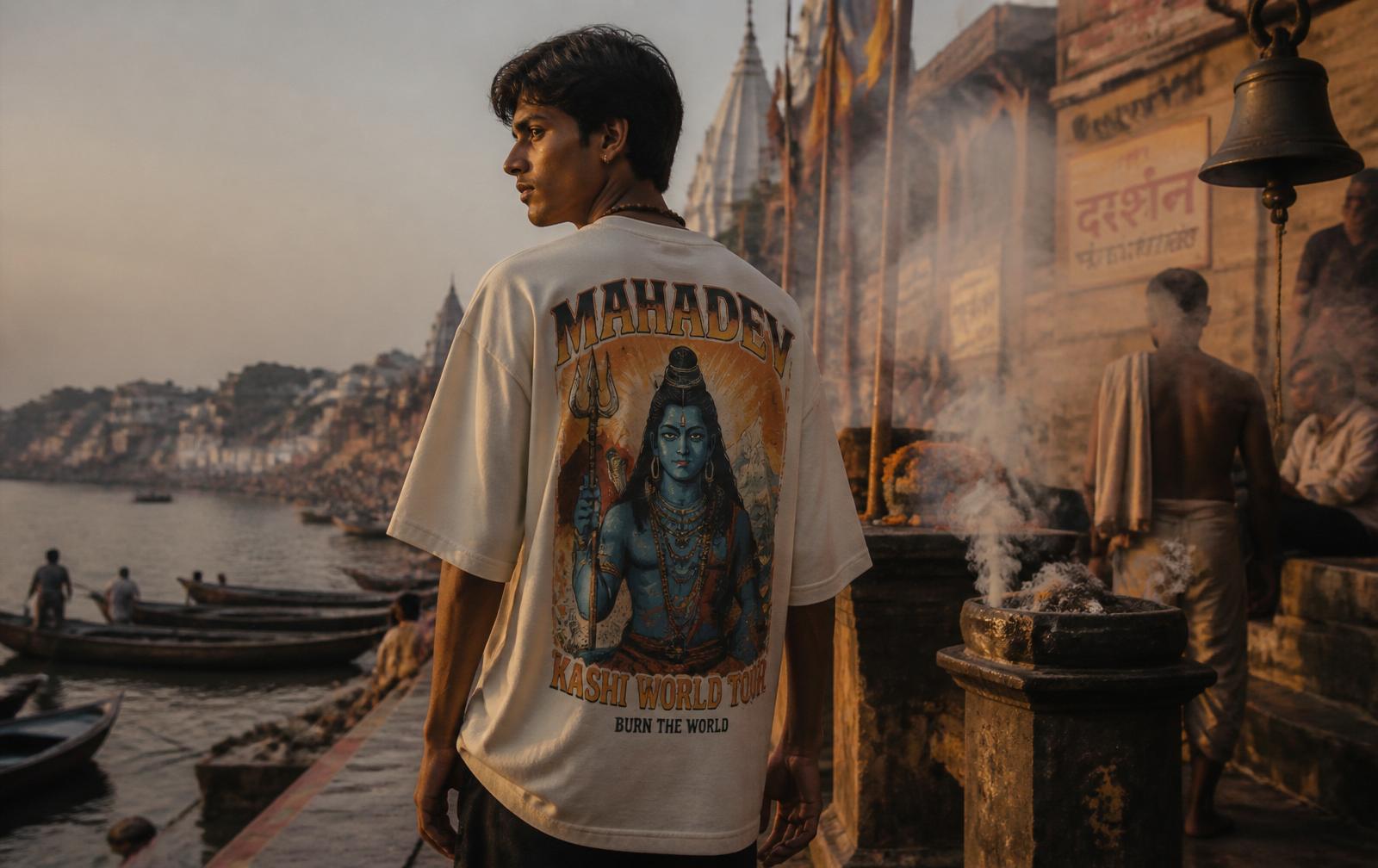 Model wearing the Mahadev tee on a Varanasi ghat at golden hour